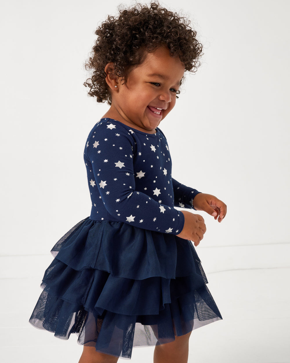 Close up of girl wearing the Hanukkah Stars Tiered Tutu Dress with Bloomer