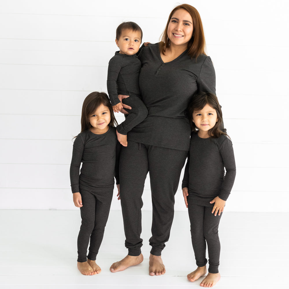 mother and three kids matching wearing Cozy Heather Black pjs sets in womens, and children's two piece and zippy styles.