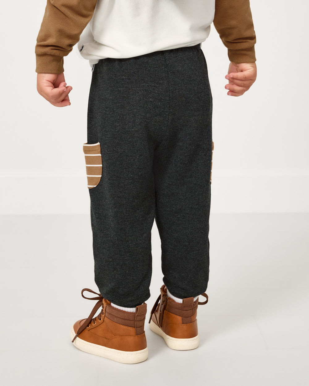 Back view of child wearing the Heather Black Cinched Jogger