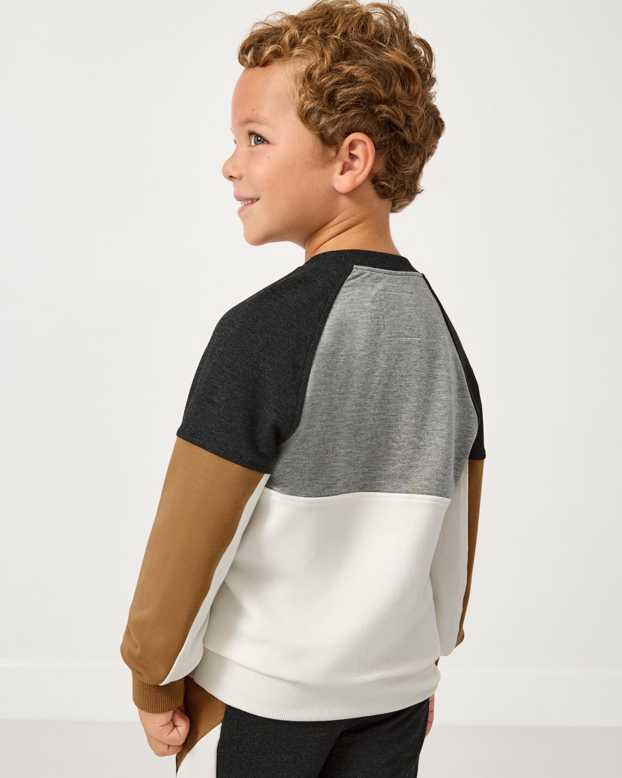 Back side of child wearing the Heather Gray Panel Crewneck