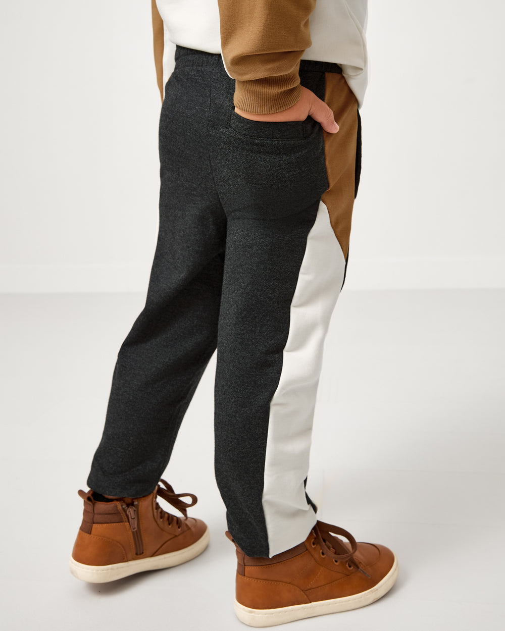 Boy wearing the Heather Black Panel Jogger with his hand in the pocket