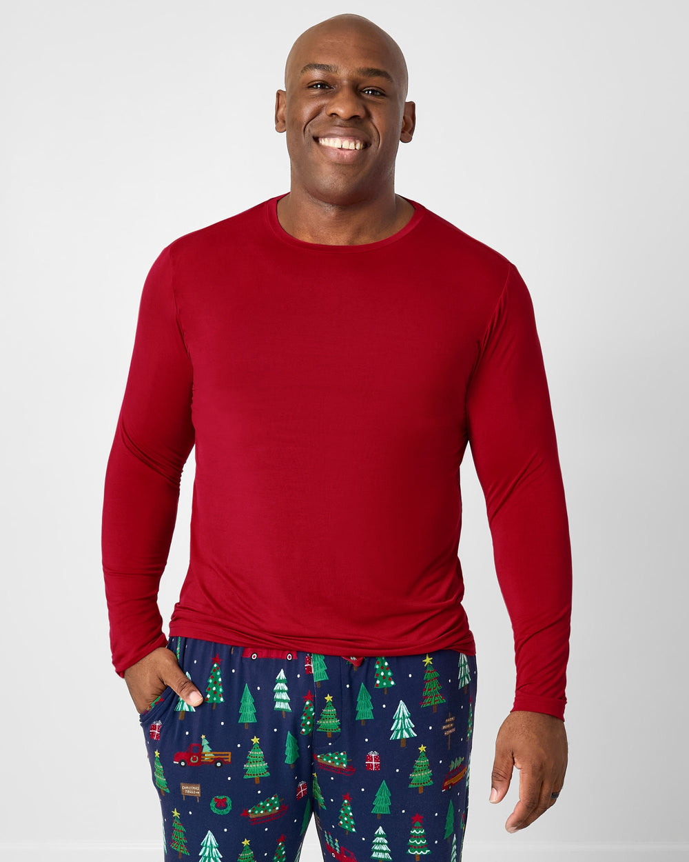 Man wearing the Holiday Red Men's Long Sleeve Pajama Top