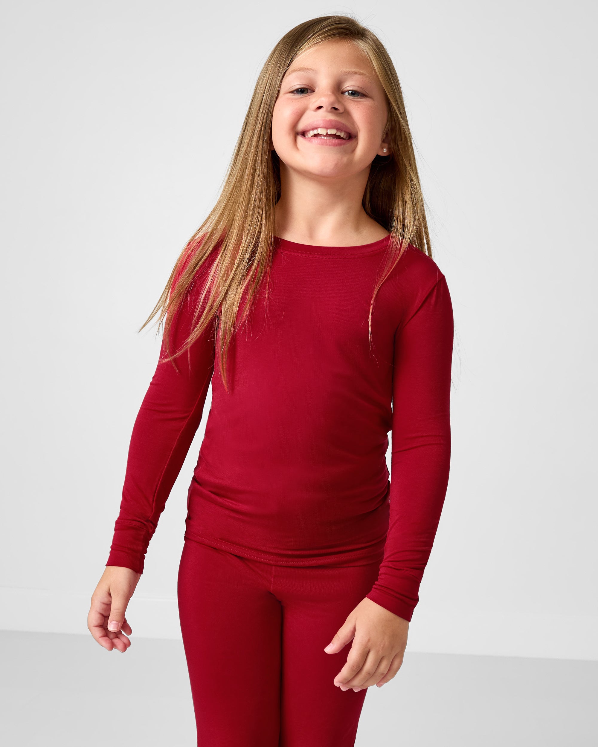 Close up of girl wearing the Holiday Red Two-Piece Pajama Set