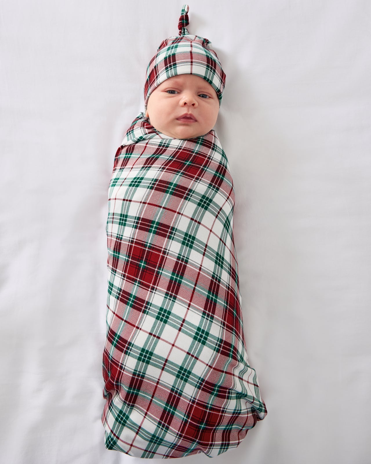 Aerial view of the Holly Plaid Swaddle & Hat Set