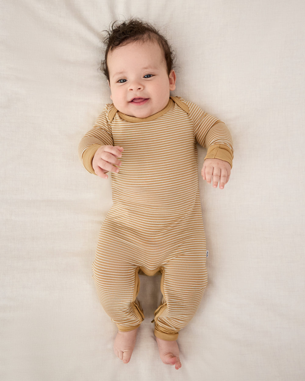 Aerial view of baby wearing the Hazelwood Stripe Crescent Zippy