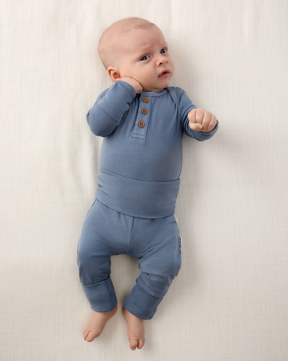 Baby wearing the Hazy Blue Henley Bodysuit and Newborn Legging