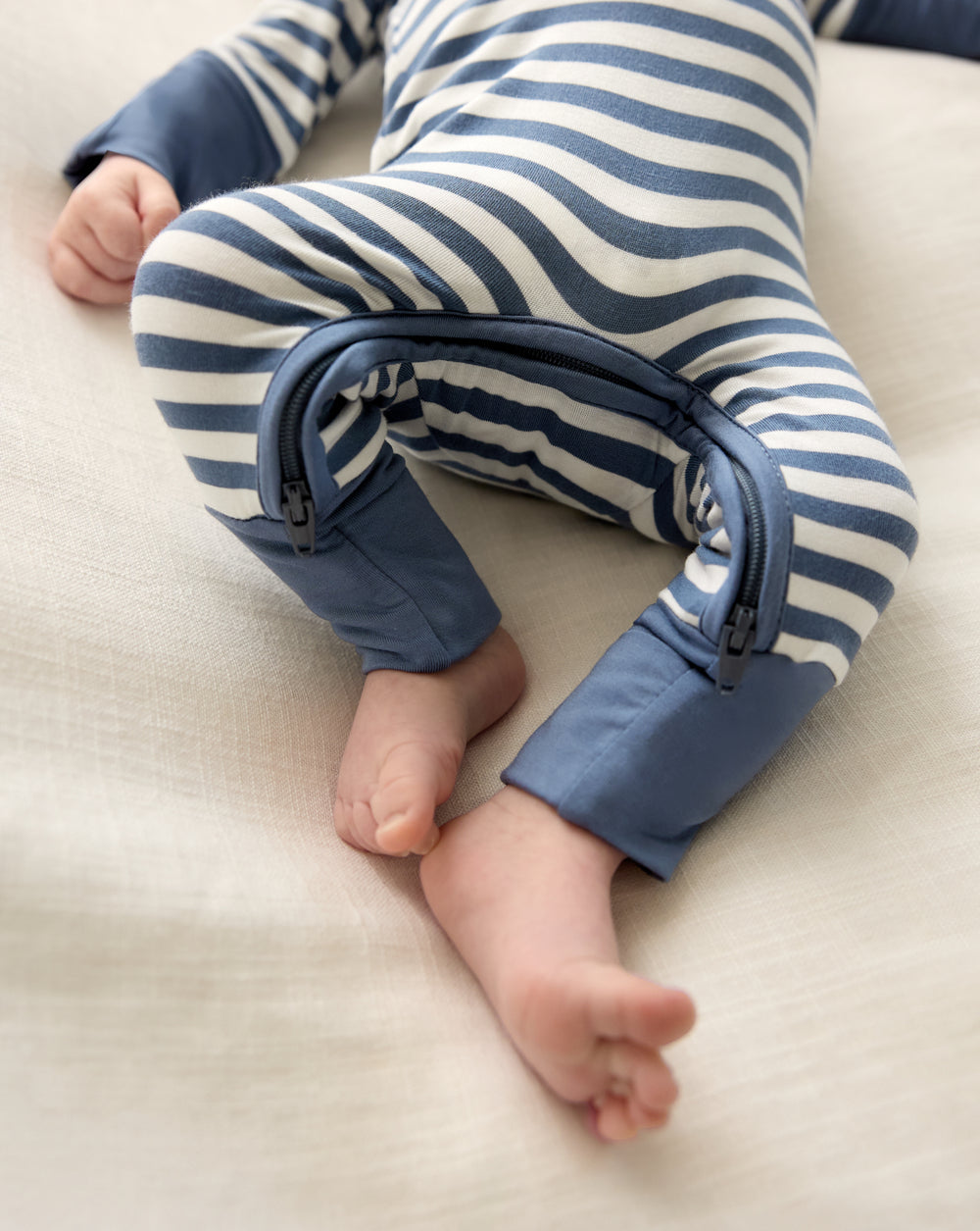 Close up of the zipper detail on the Hazy Blue Stripe Crescent Zippy