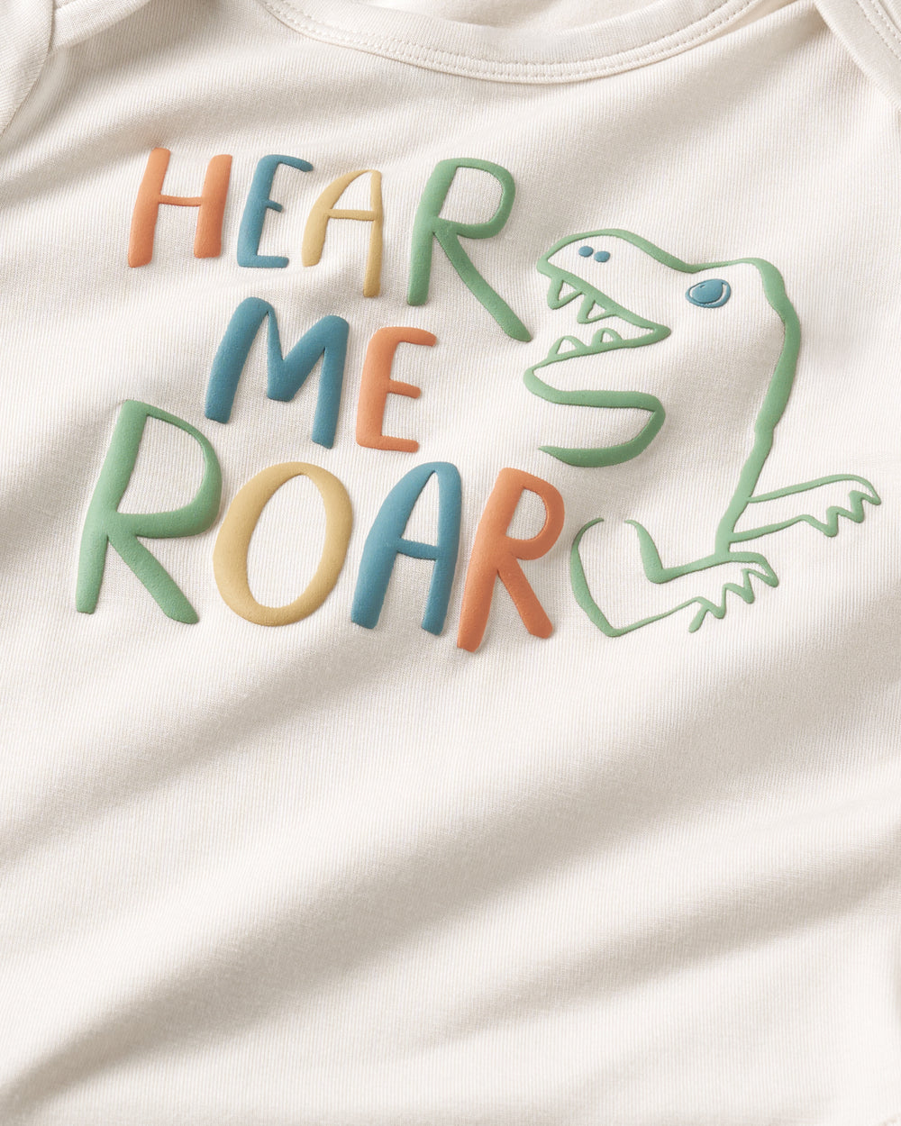 Flat lay of the front of the Hear Me Roar Bodysuit