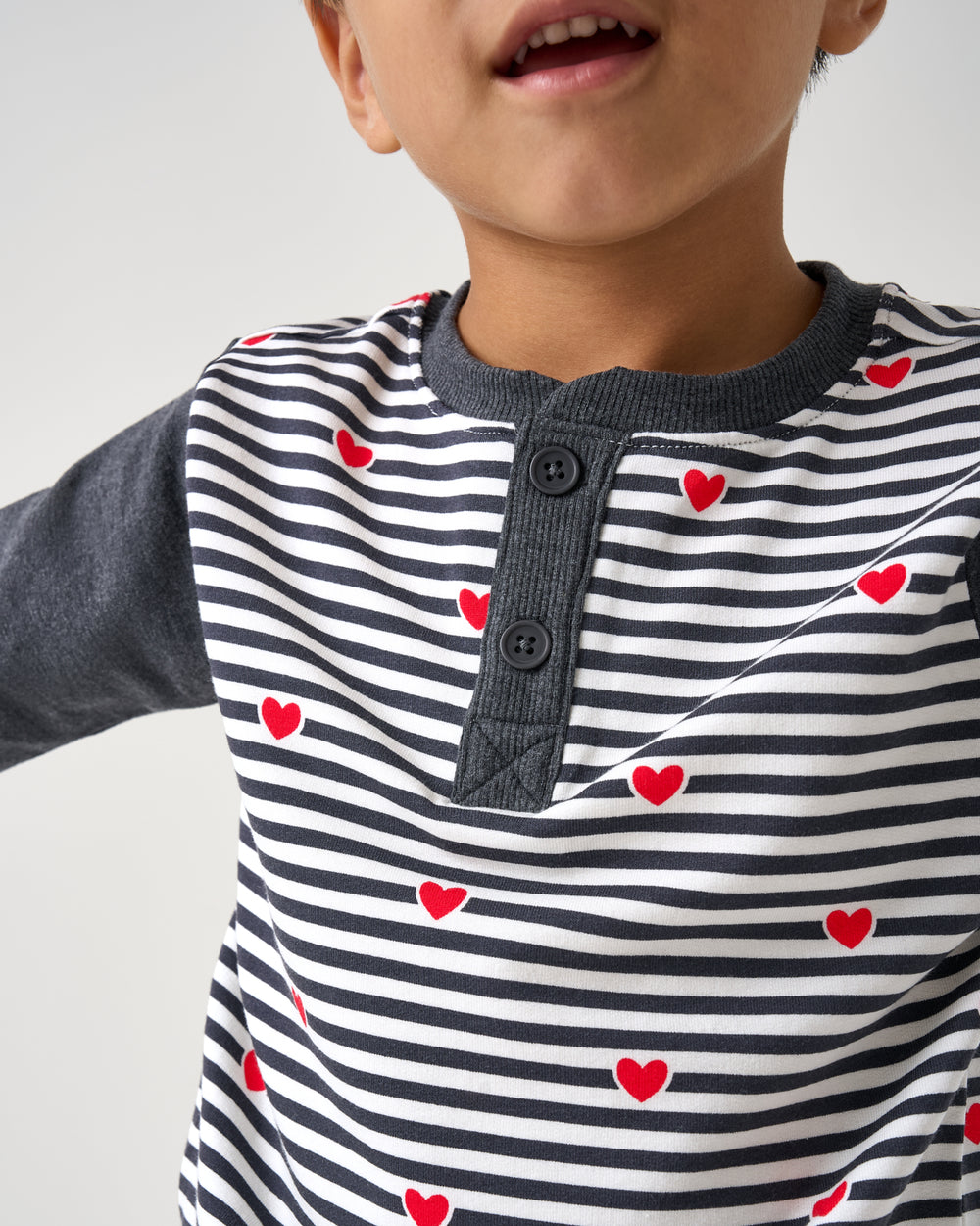 Close up of the henley detail on the Heartstrings Stripe Henley Tee