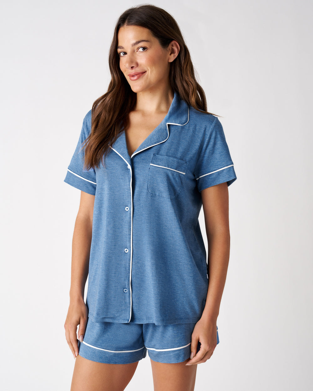 Woman wearing the Heather Blue Women's Short Sleeve & Shorts Pajama Set on a white background