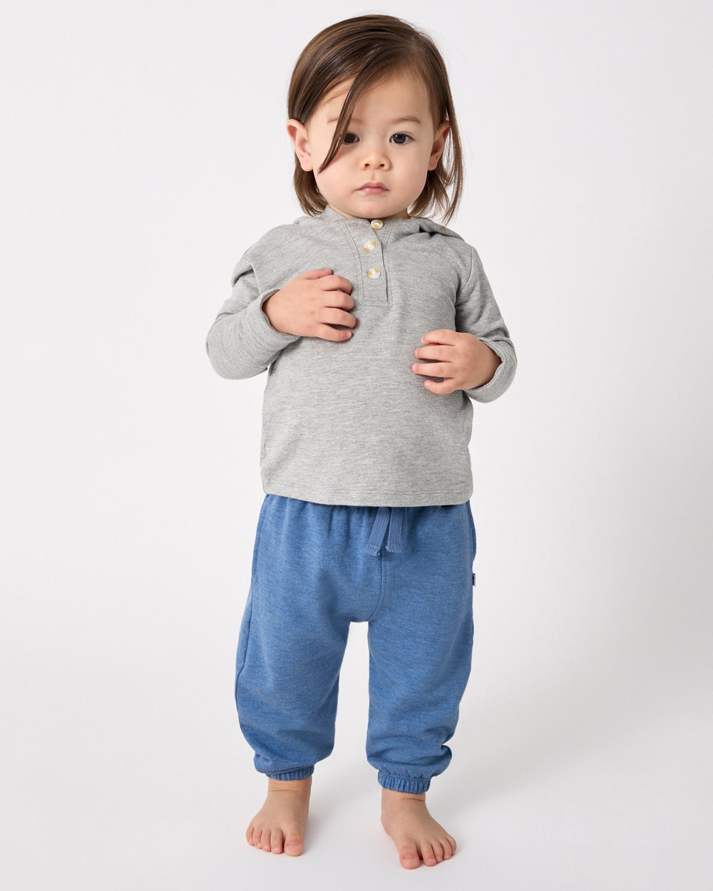 Boy wearing the Heather Blue Jogger and Gray Hoodie