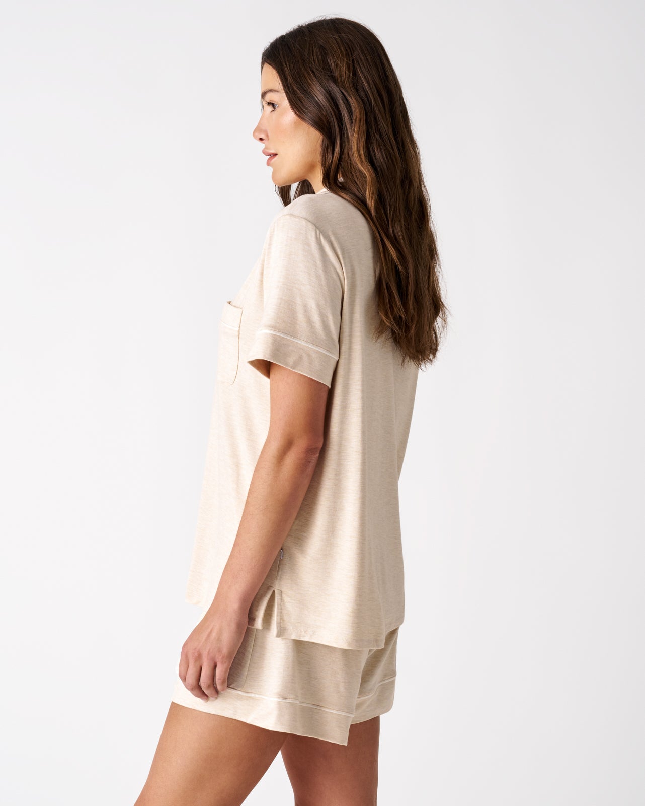 Side view of woman wearing the Heather Oatmeal Women's Short Sleeve & Shorts Pajama Set