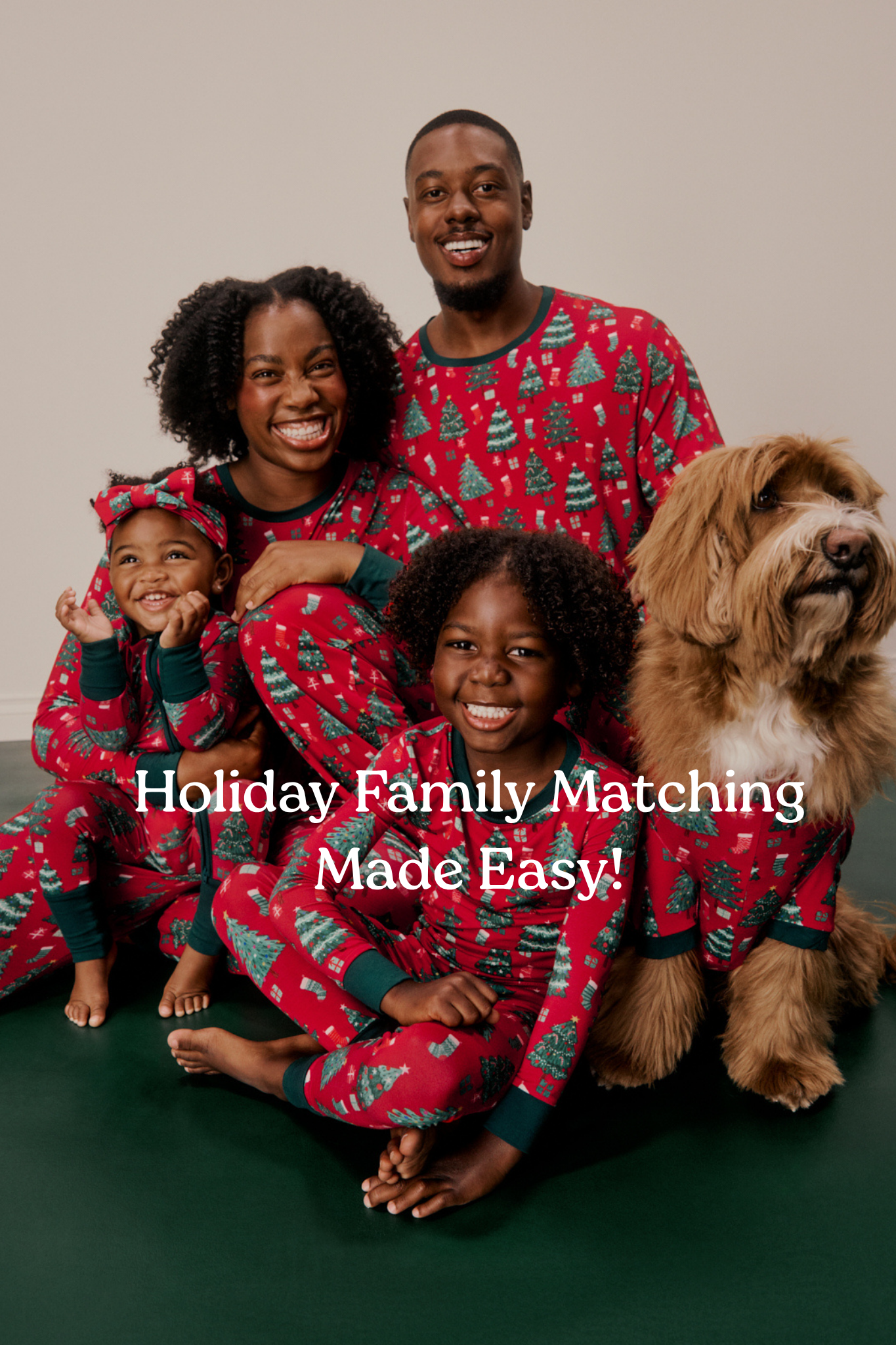 Family with dog wearing matching Joyful Traditions Christmas pajamas