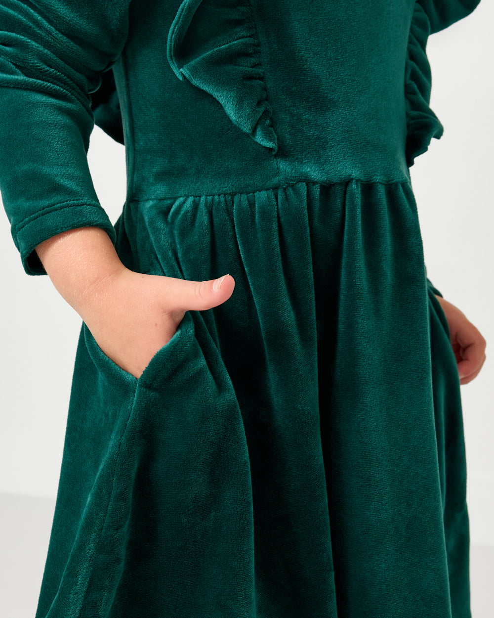 Close up of the pocket detail on the Emerald Velvet Easy Fit Flutter Dress 