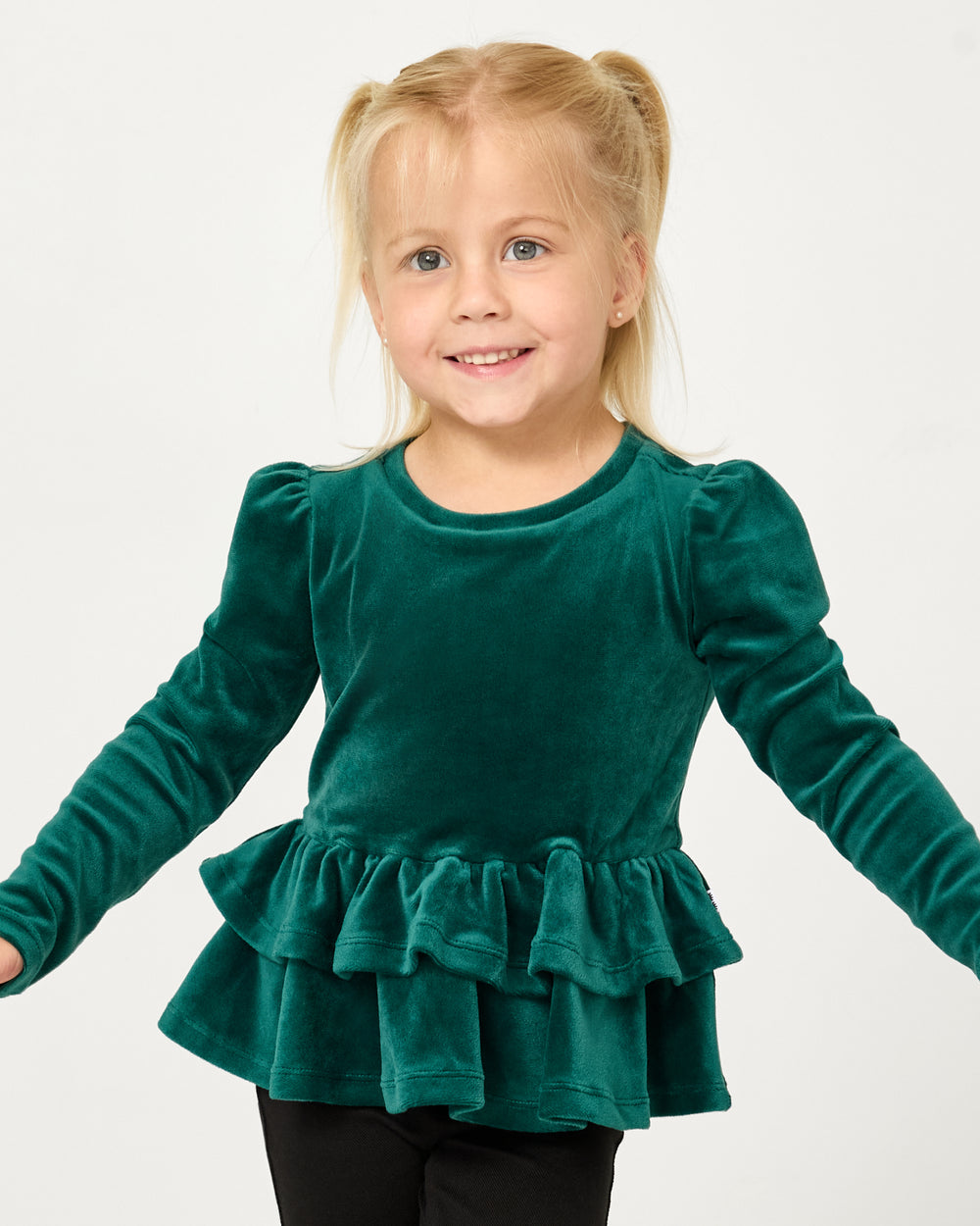 Girl wearing the Emerald Velvet Tiered Peplum Top