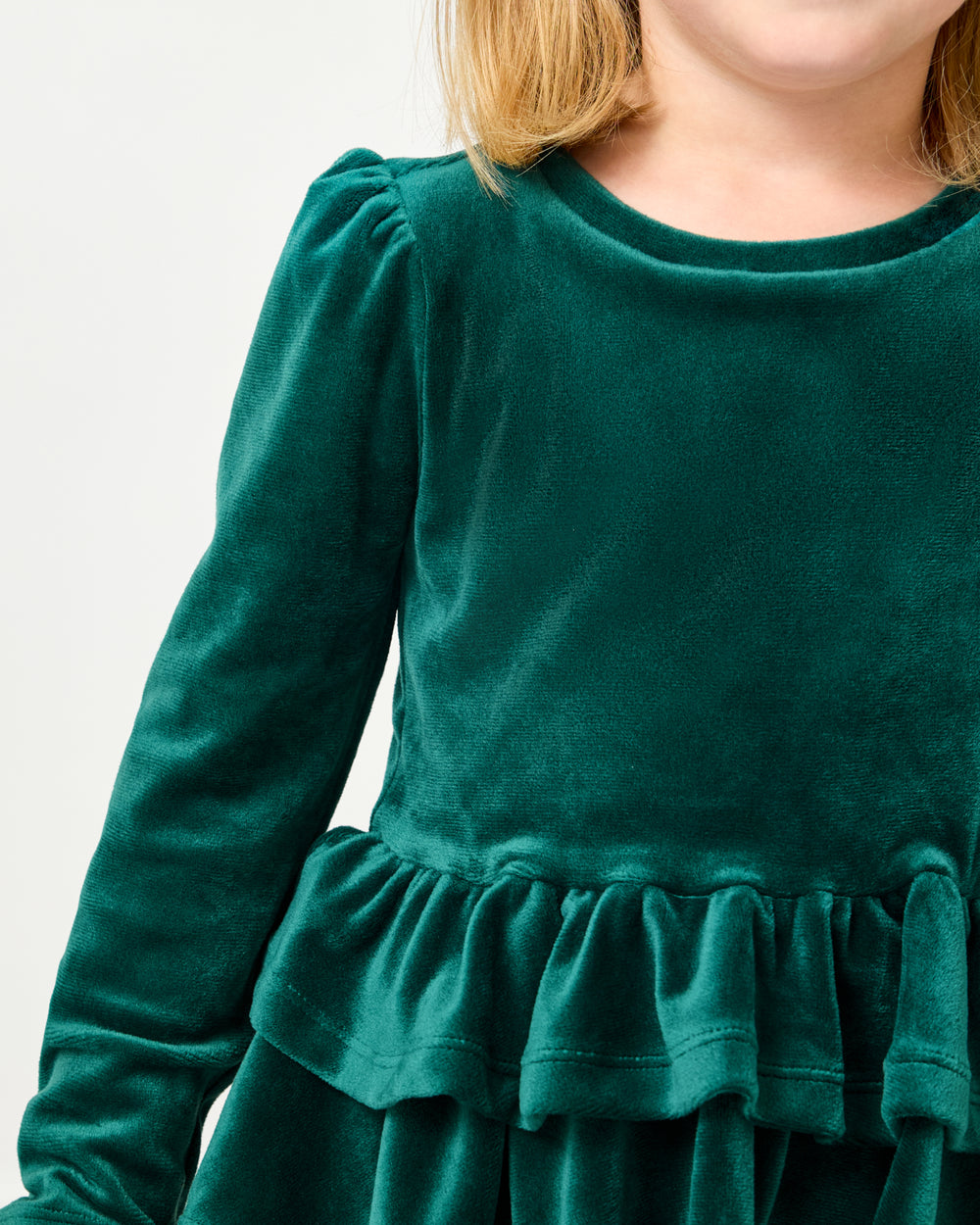 Close up of the puff shoulder on the Emerald Velvet Tiered Peplum Top