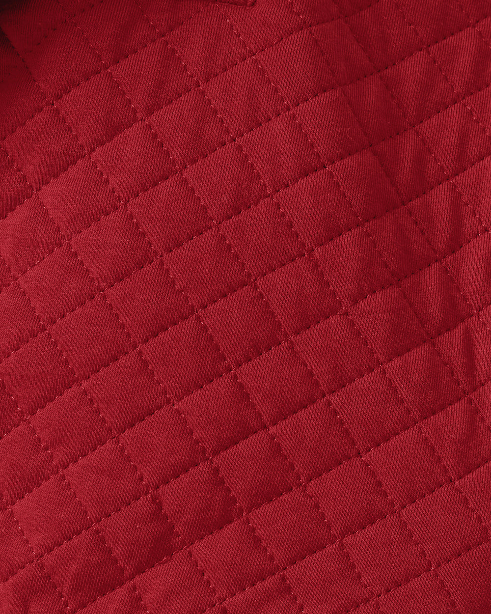 Close up of the quilted fabric on the Holiday Red Quilted Zip Pullover