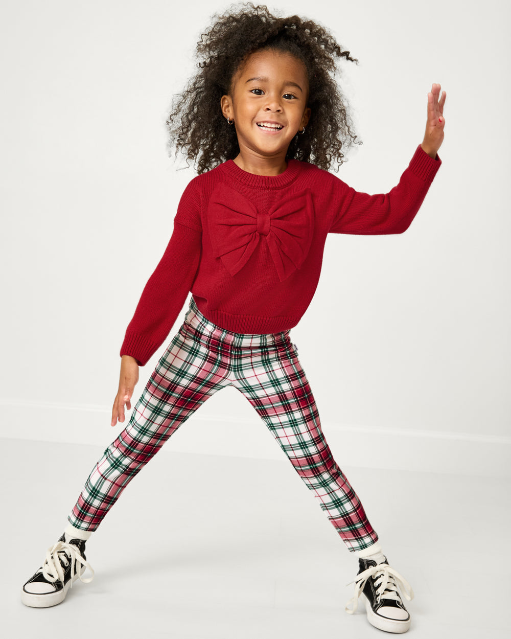Posing girl wearing the Holly Plaid Legging