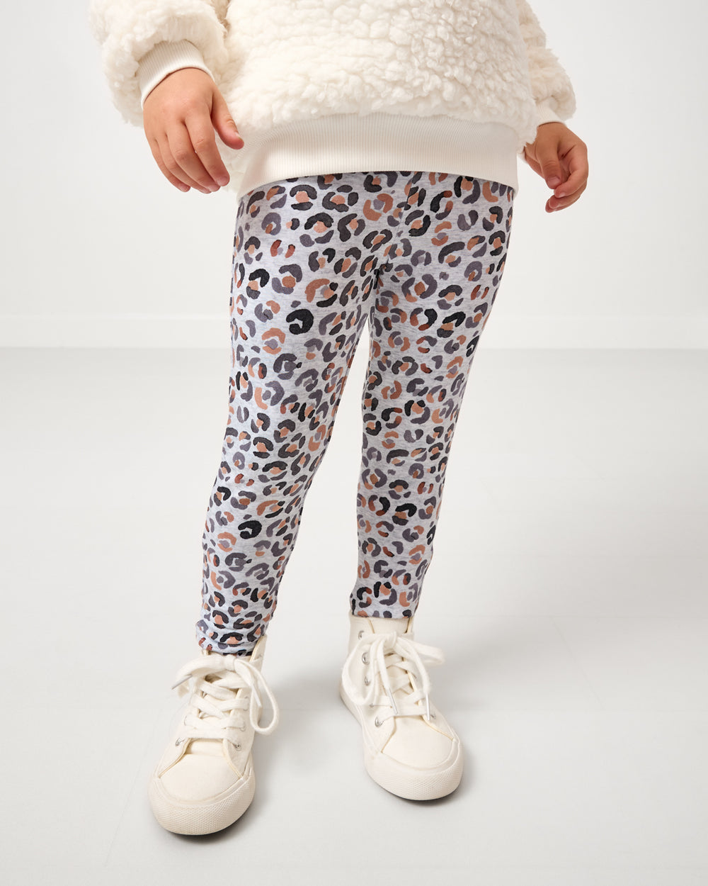 Girl wearing the Snowy Leopard Legging
