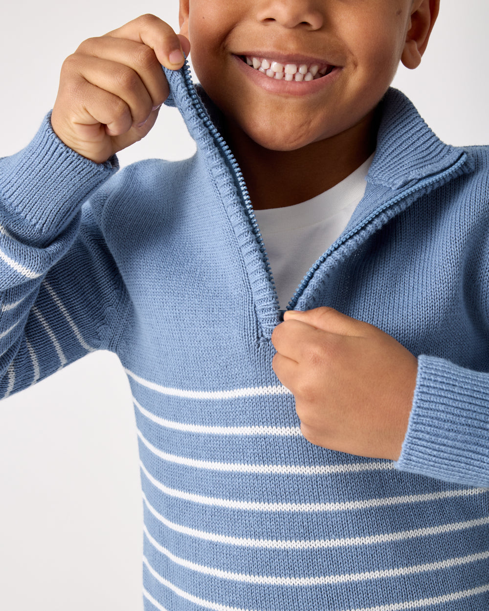 Close up of the zipper detail on the Infinite Blue Stripe Zip Sweater