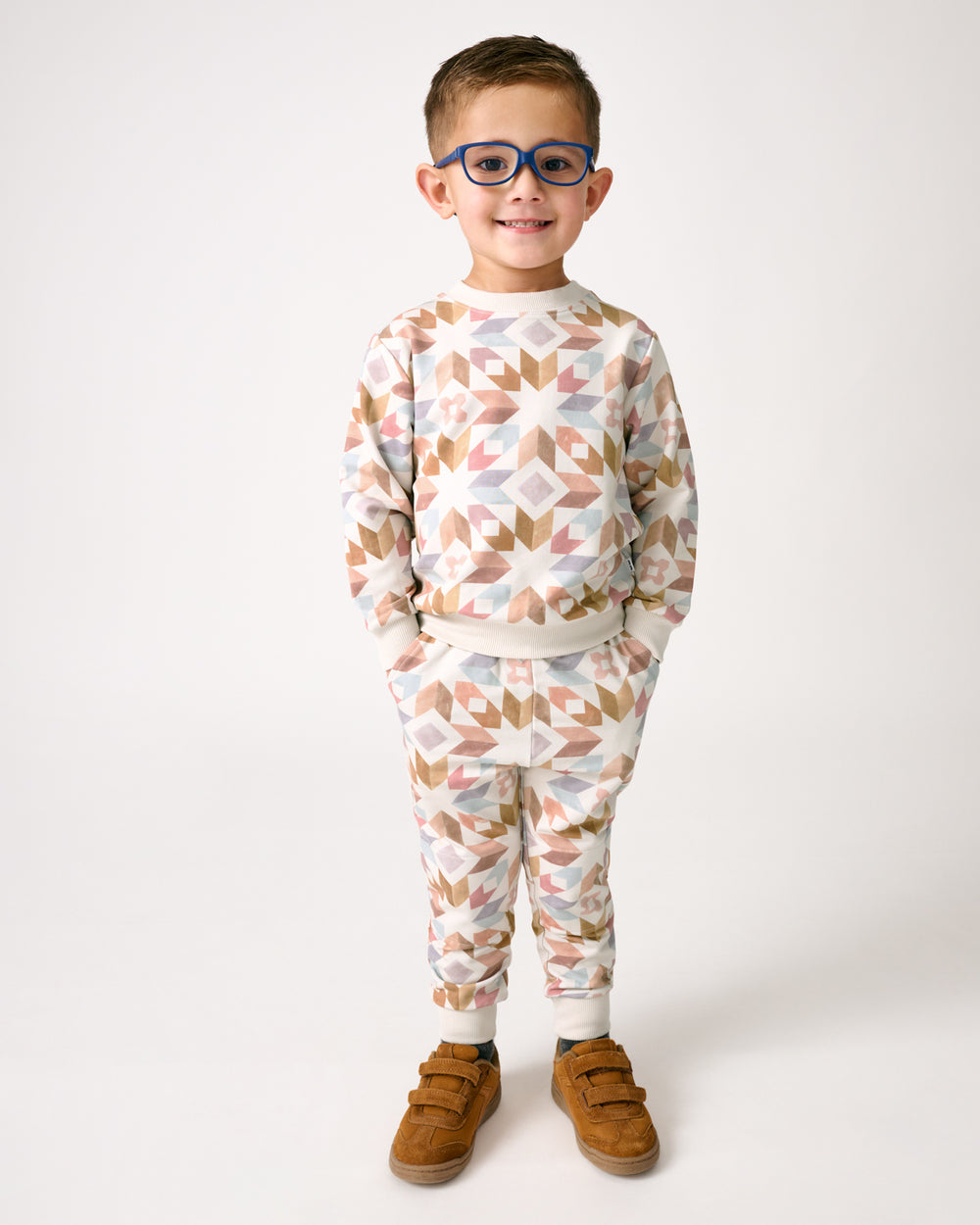 Standing boy wearing the Kaleidoscope Dreams Jogger and Crewneck Sweatshirt