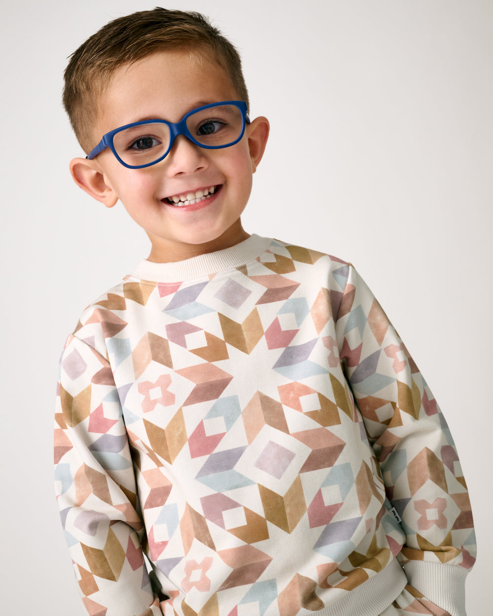 Boy wearing the Kaleidoscope Dreams Crewneck Sweatshirt