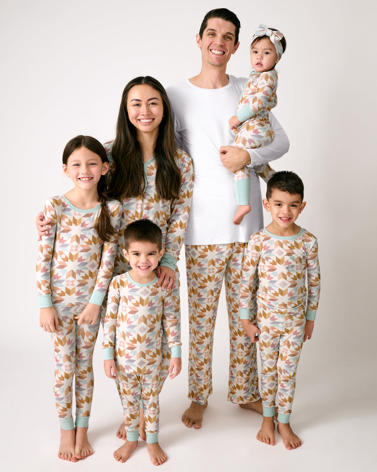 Family of six wearing matching Kaleidoscope Dreams Ribbed Pajamas
