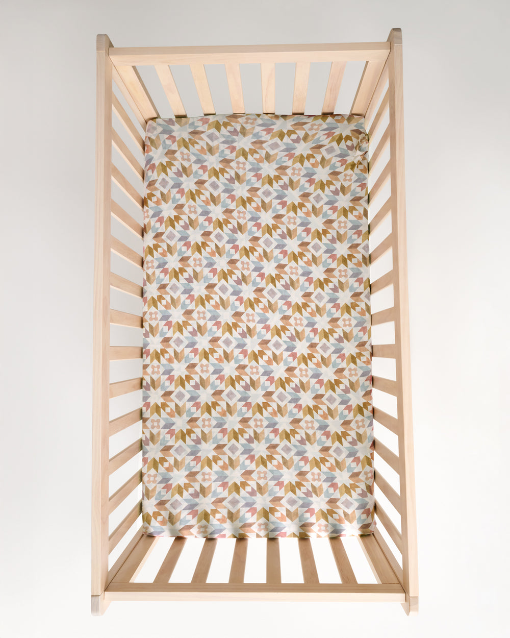 Overhead view of the Kaleidoscope Dreams Fitted Crib Sheet