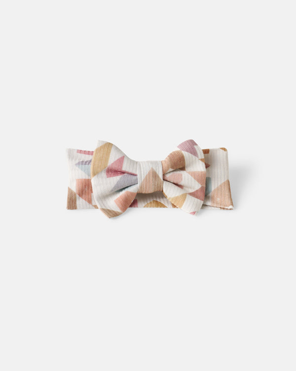 Flat lay of the Kaleidoscope Dreams Ribbed Luxe Bow Headband