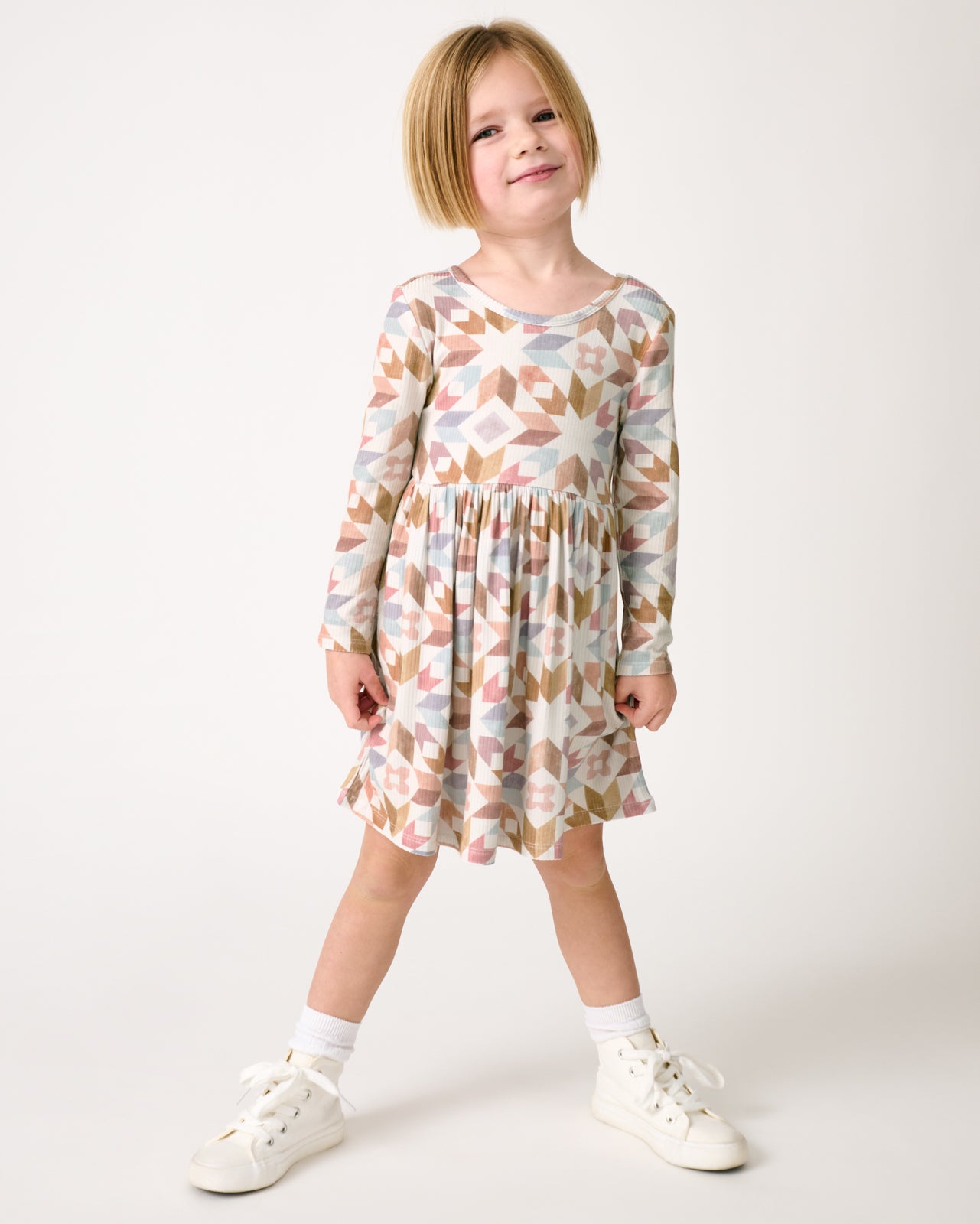 Standing girl wearing the Kaleidoscope Dreams Ribbed Skater Dress