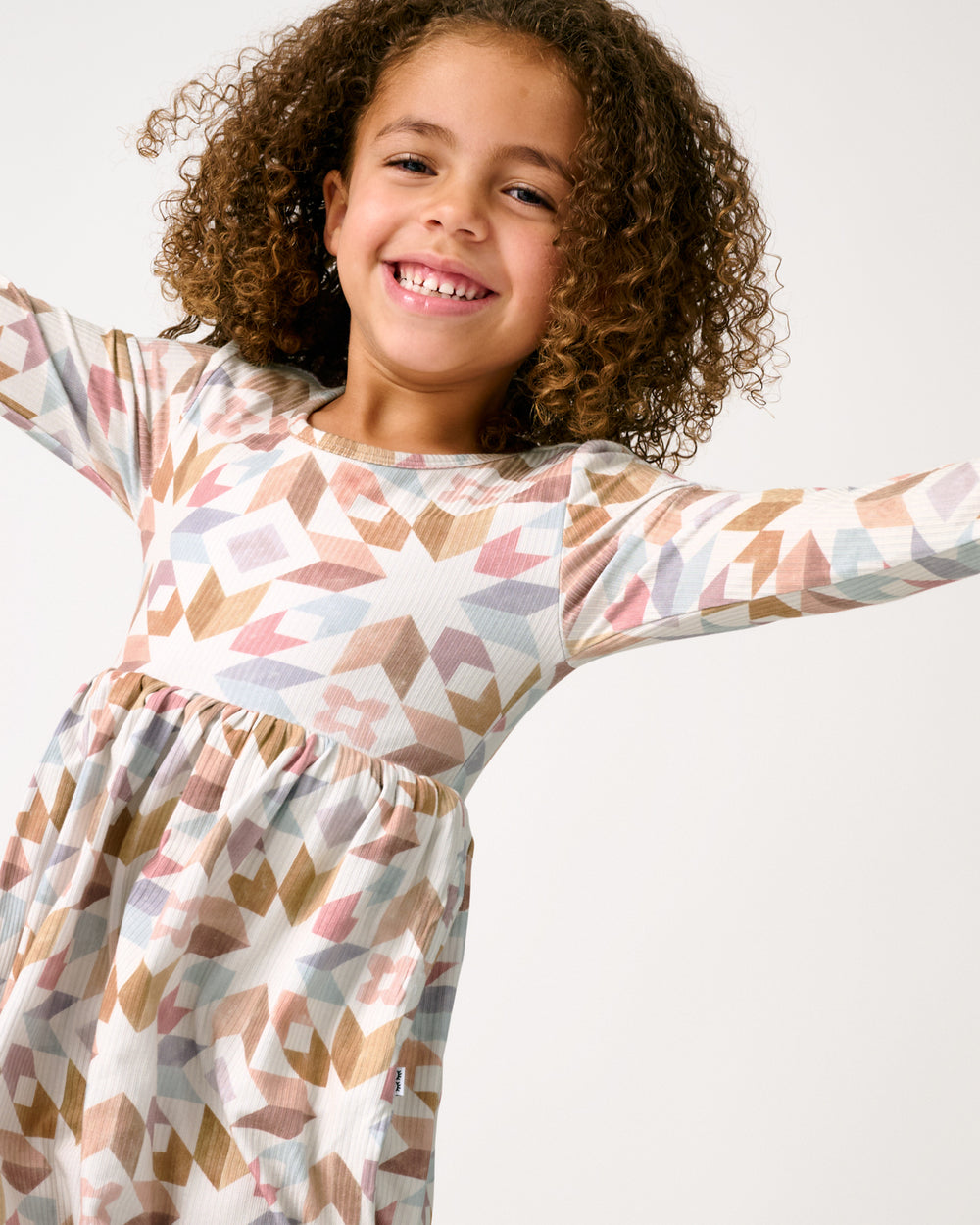 Close up of girl wearing the Kaleidoscope Dreams Ribbed Skater Dress