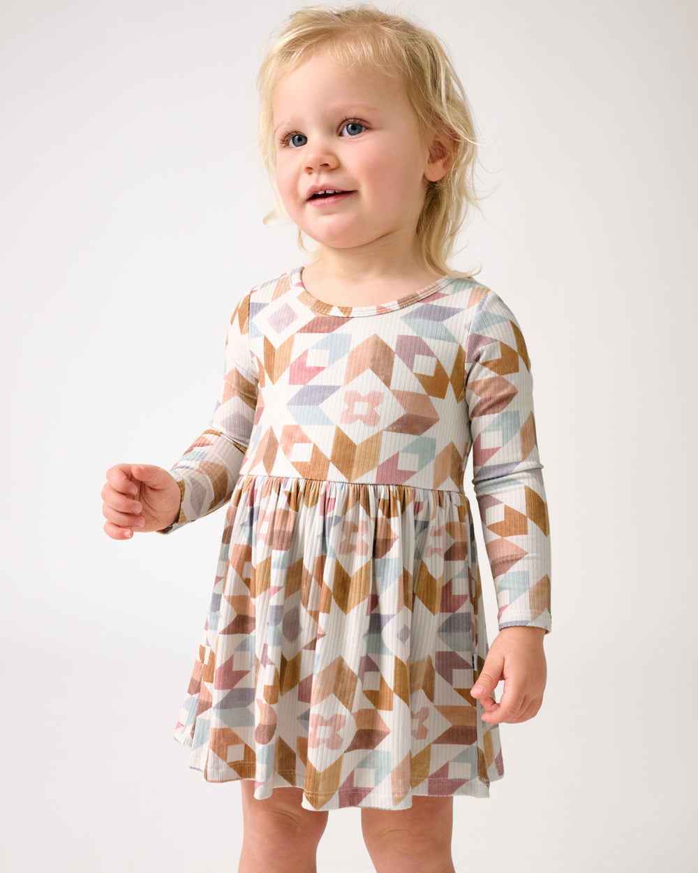 Close up of toddler wearing the Kaleidoscope Dreams Ribbed Skater Dress with Bodysuit