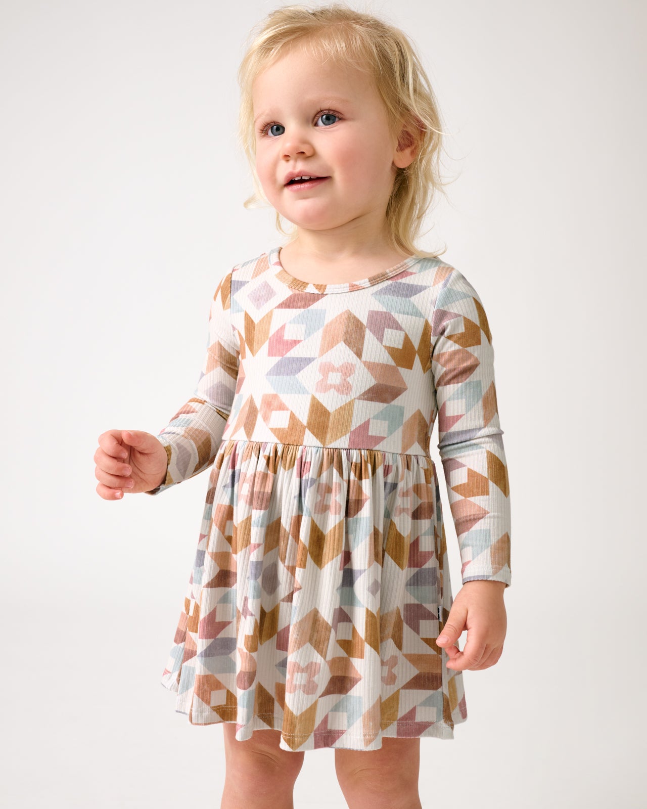 Close up of toddler wearing the Kaleidoscope Dreams Ribbed Skater Dress with Bodysuit
