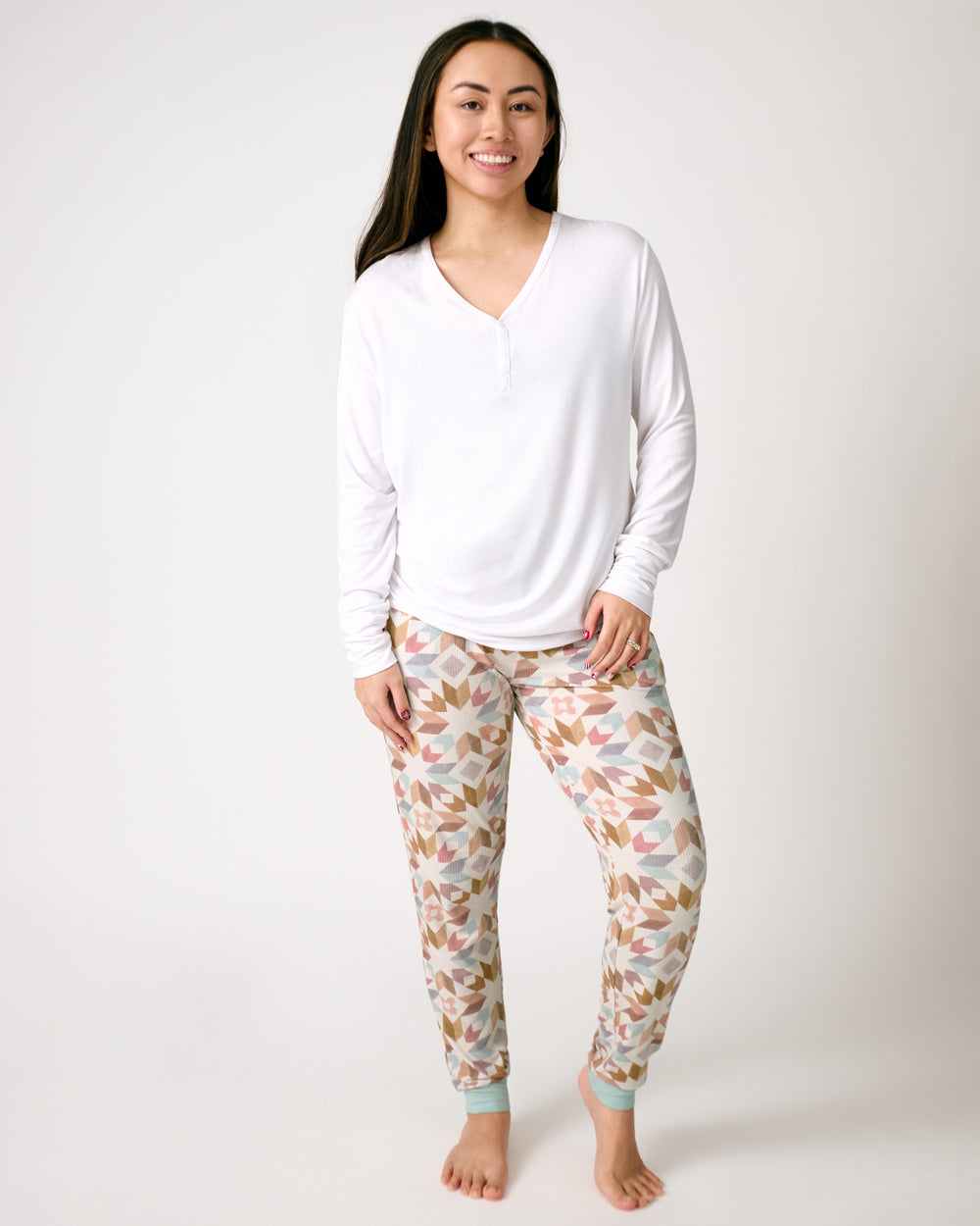 Woman wearing the Kaleidoscope Dreams Ribbed Women's Pajama Pants with a white top