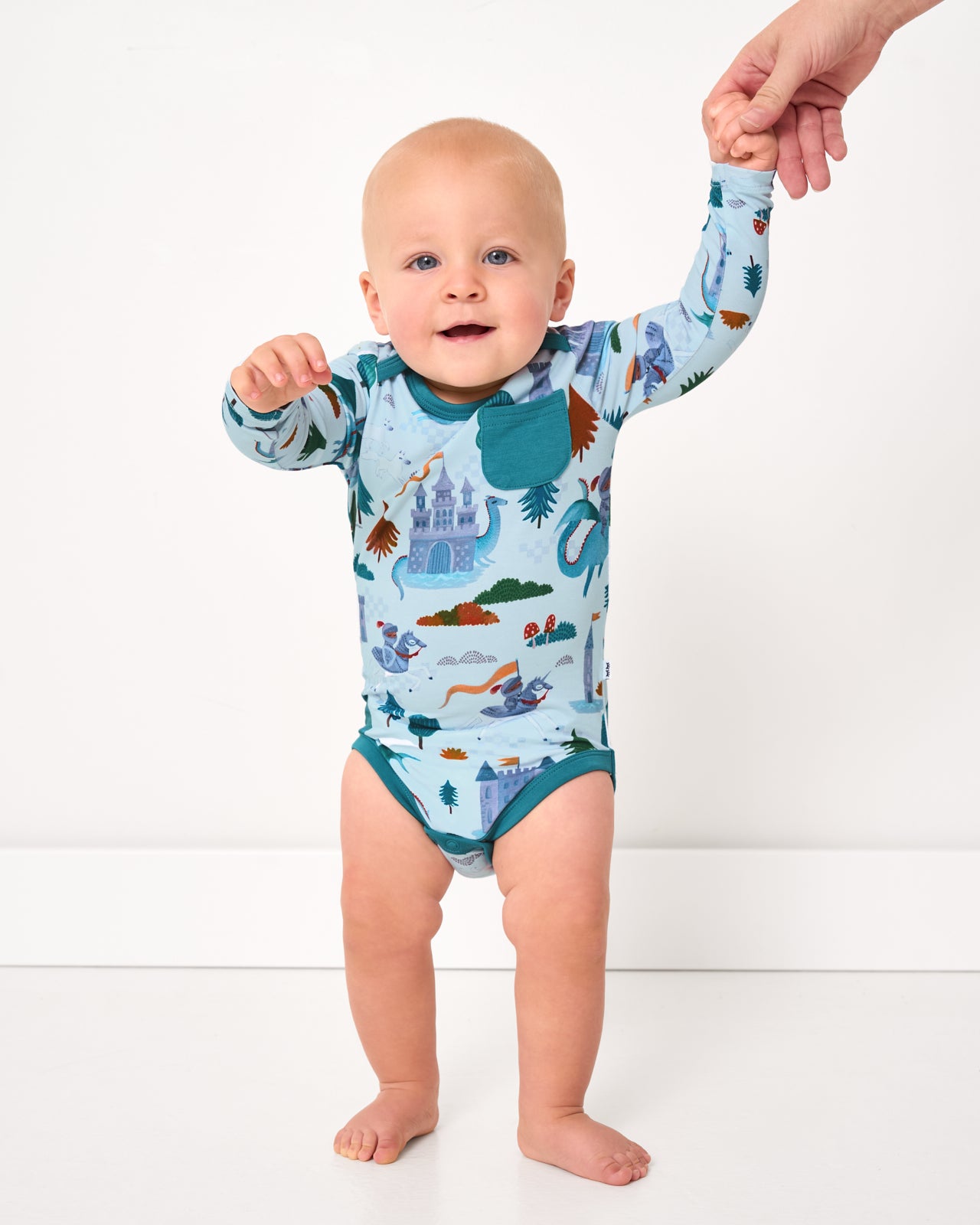 Walking baby wearing the Knight's Quest Pocket Bodysuit