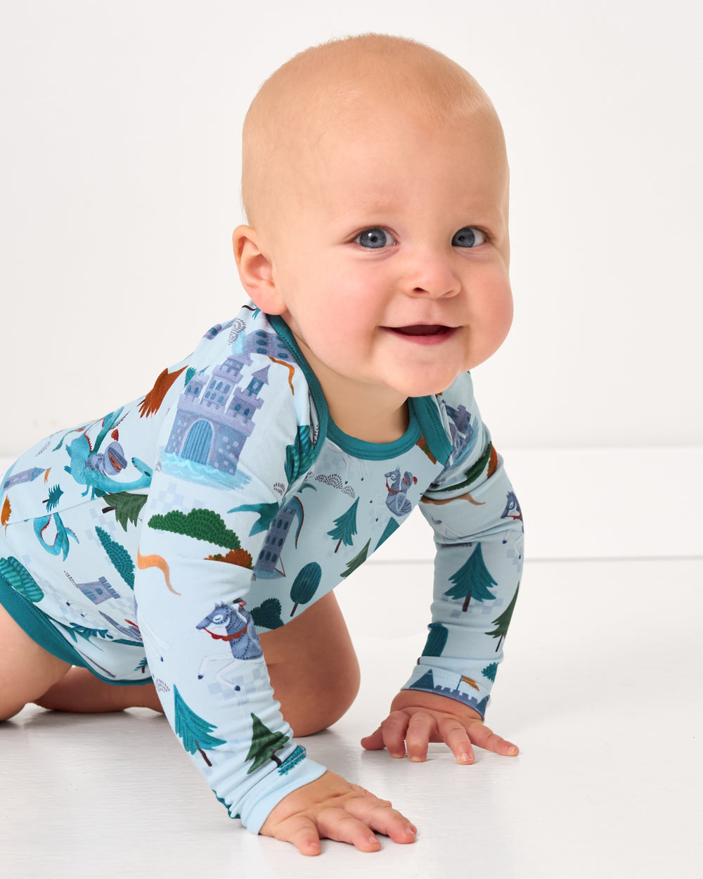Crawling baby wearing the Knight's Quest Pocket Bodysuit