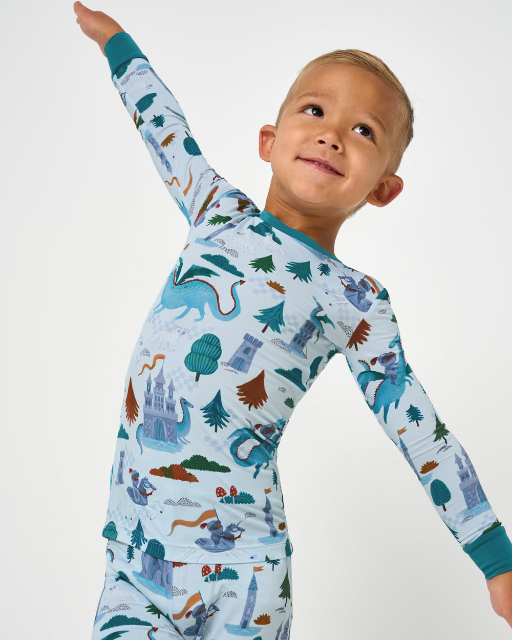 Close up of boy wearing the Knight's Quest Two-Piece Pajama Set