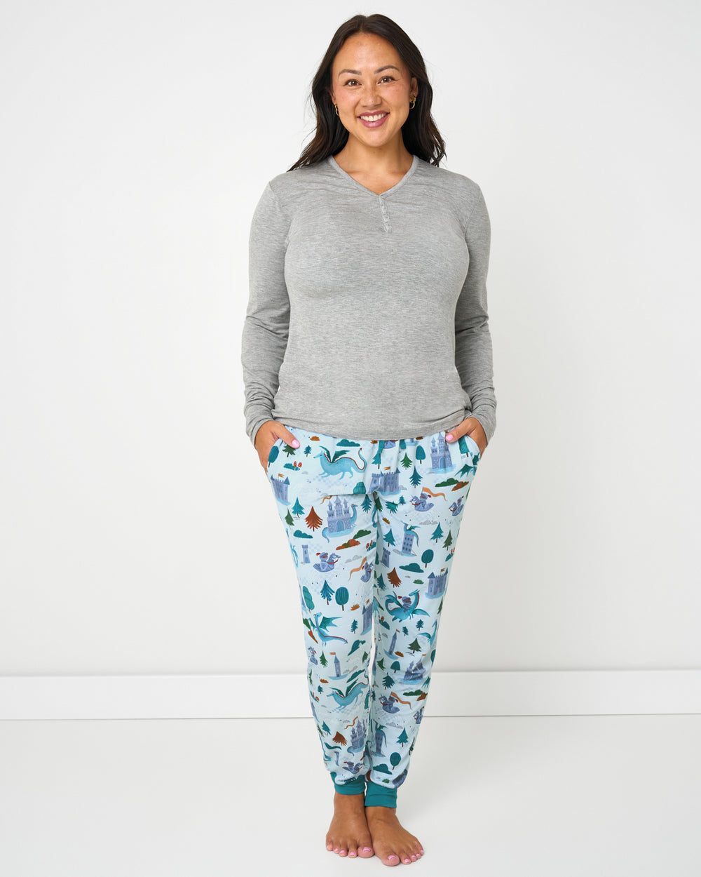 Woman wearing the Knight's Quest Women's Pajama Pants with a gray bamboo pajama top