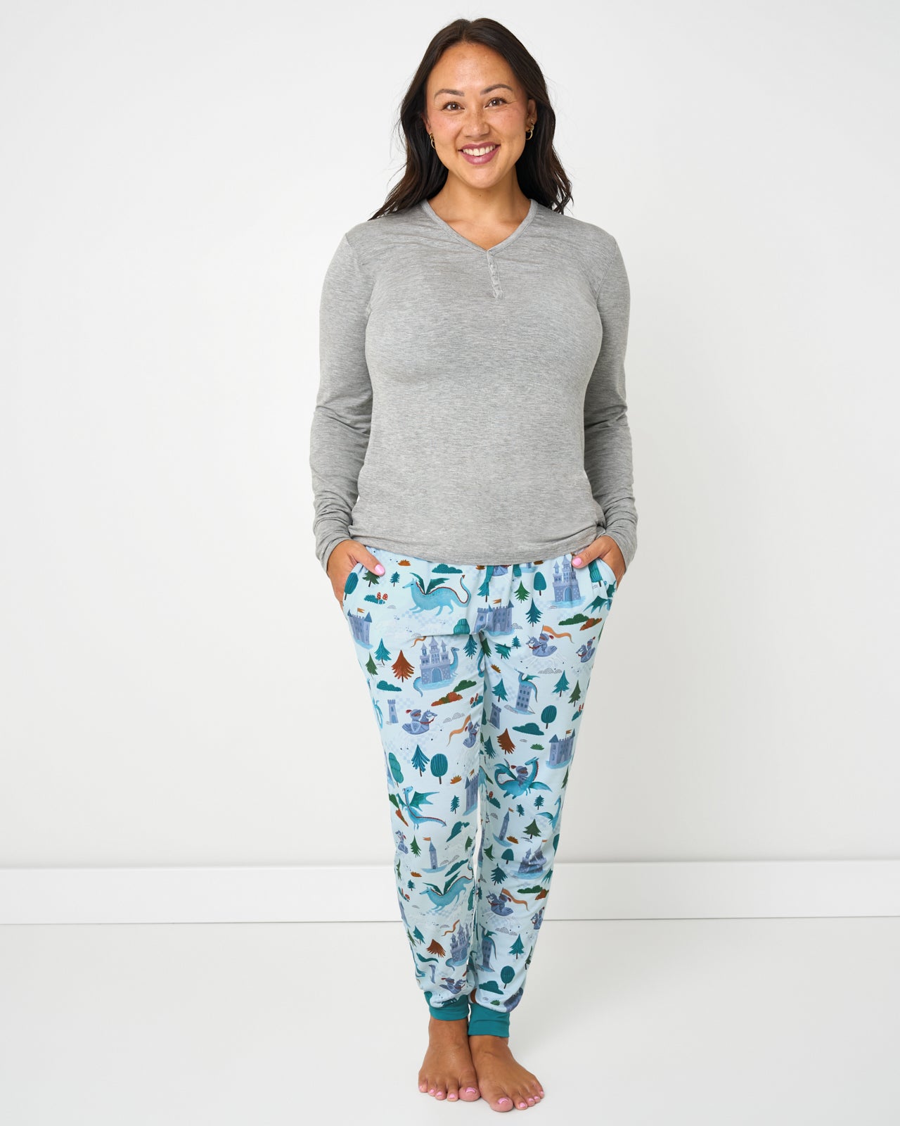 Woman wearing the Knight's Quest Women's Pajama Pants with a gray bamboo pajama top