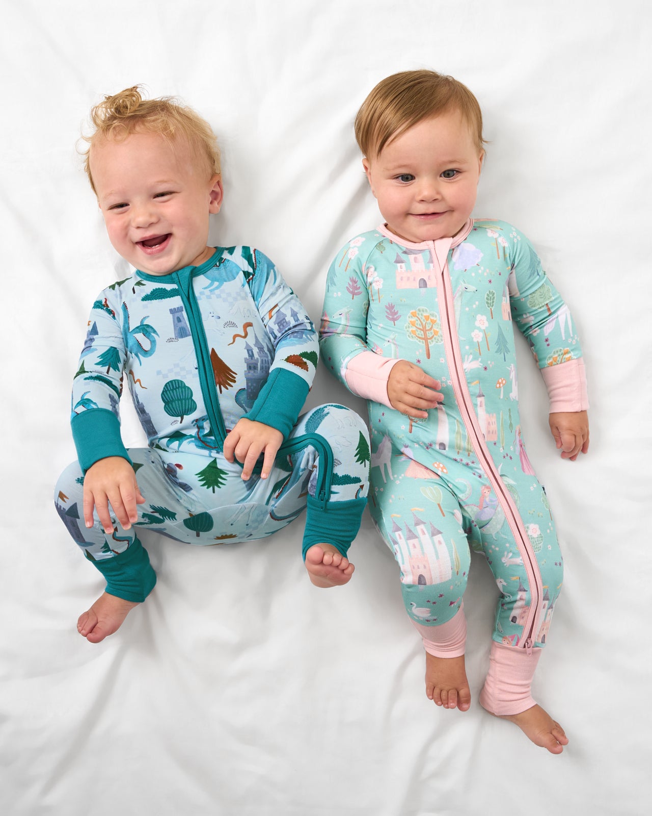 Aerial view of two babies wearing Knight's Quest and Enchanted Fairytale Zippies