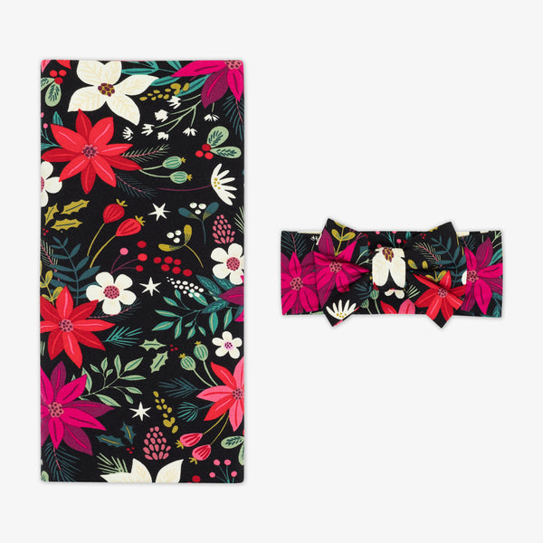 Flat lay image of the Berry Merry Swaddle & Luxe Bow Headband Set