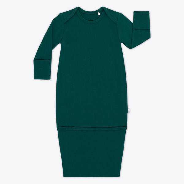 Flat lay image of the Emerald Infant Gown