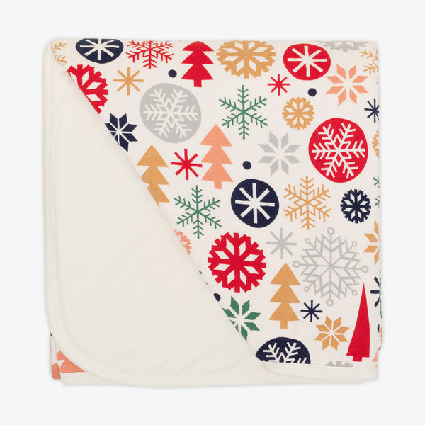 Flat lay image of the Modern & Merry Large Cloud Blanket® folded