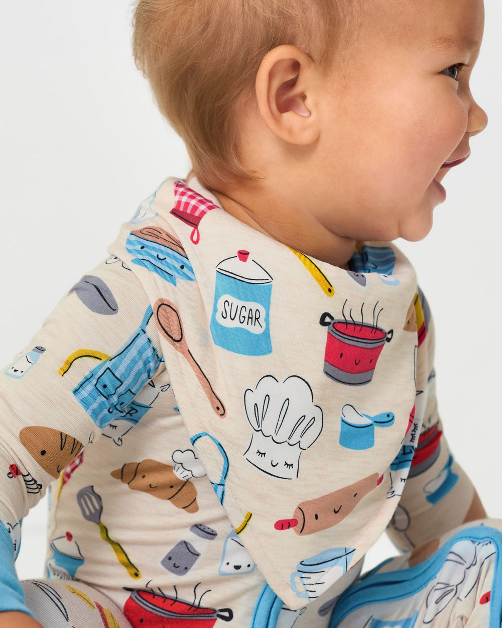 Close up of baby wearing the Little Chef Bandana Bib