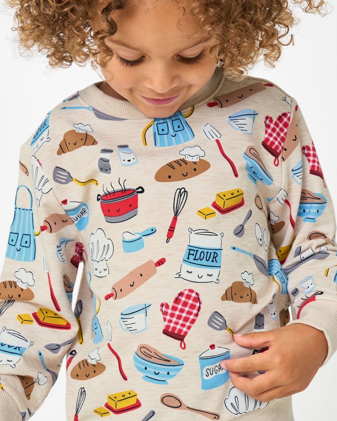 Close up of girl wearing the Little Chef Crewneck Sweatshirt