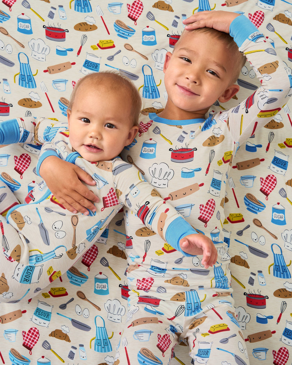 Aerial view of two children wearing matching Little Chef pajamas