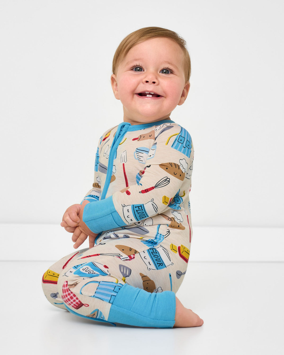 Alternate sitting baby wearing the Little Chef Bamboo Zippy