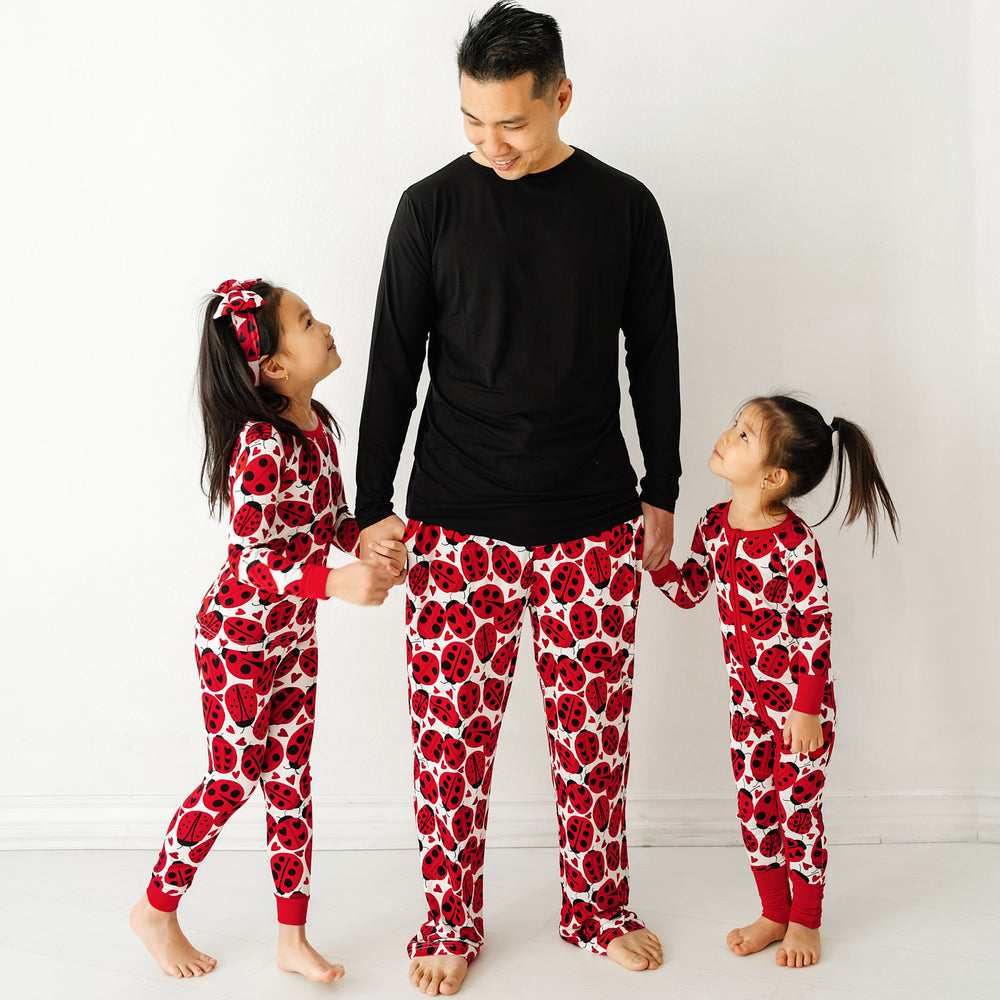 Click to see full screen - Father and two children wearing matching Love Bug printed pajamas