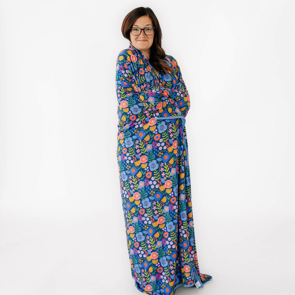 Woman wearing the Folk Floral Oversized Cloud Blanket® around her body