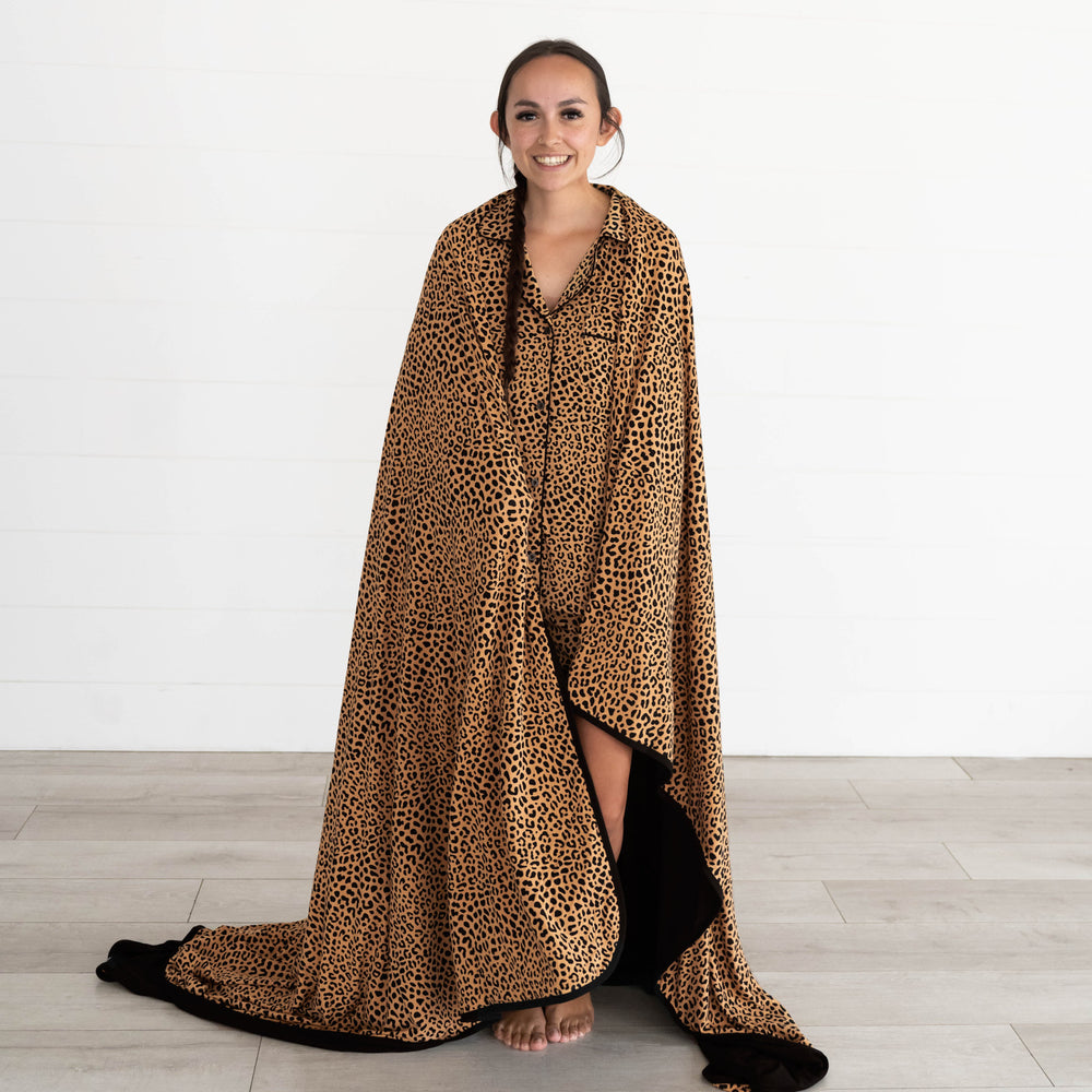 Female model wrapped in the Classic Leopard Oversized Cloud Blanket®